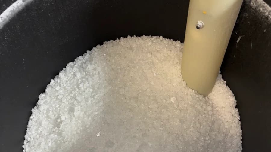 Brine tank filled with clean white softener salt after a Simply Salt delivery